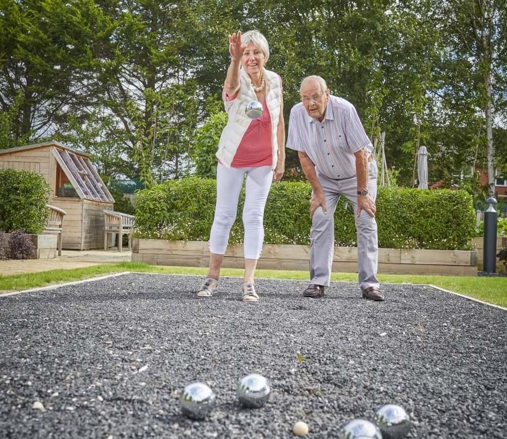 Harry and Ann, homeowners playing Petanque