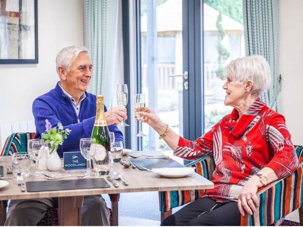 Homeowners enjoying a champagne toast as our 1,000th homeowners