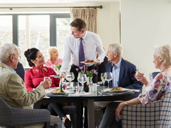 Friends enjoying a meal at the onsite restaurant