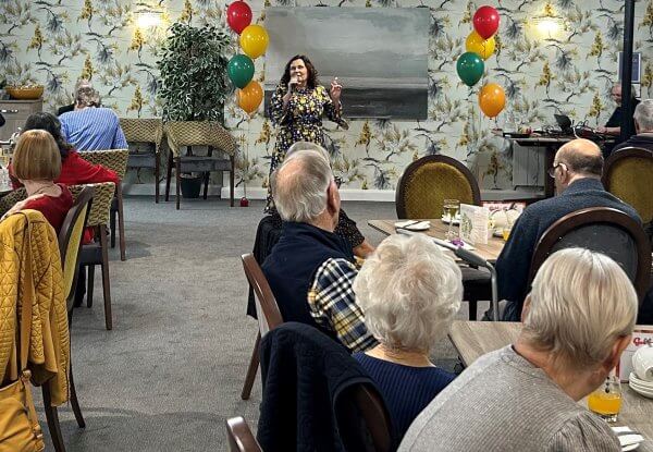 Homwoeners and guests enjoying Jane Francis' entertainment
