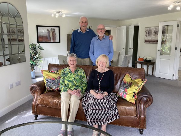 Homeowners Magaret and Keith sat with friends in their Adlington retirement living apartment.