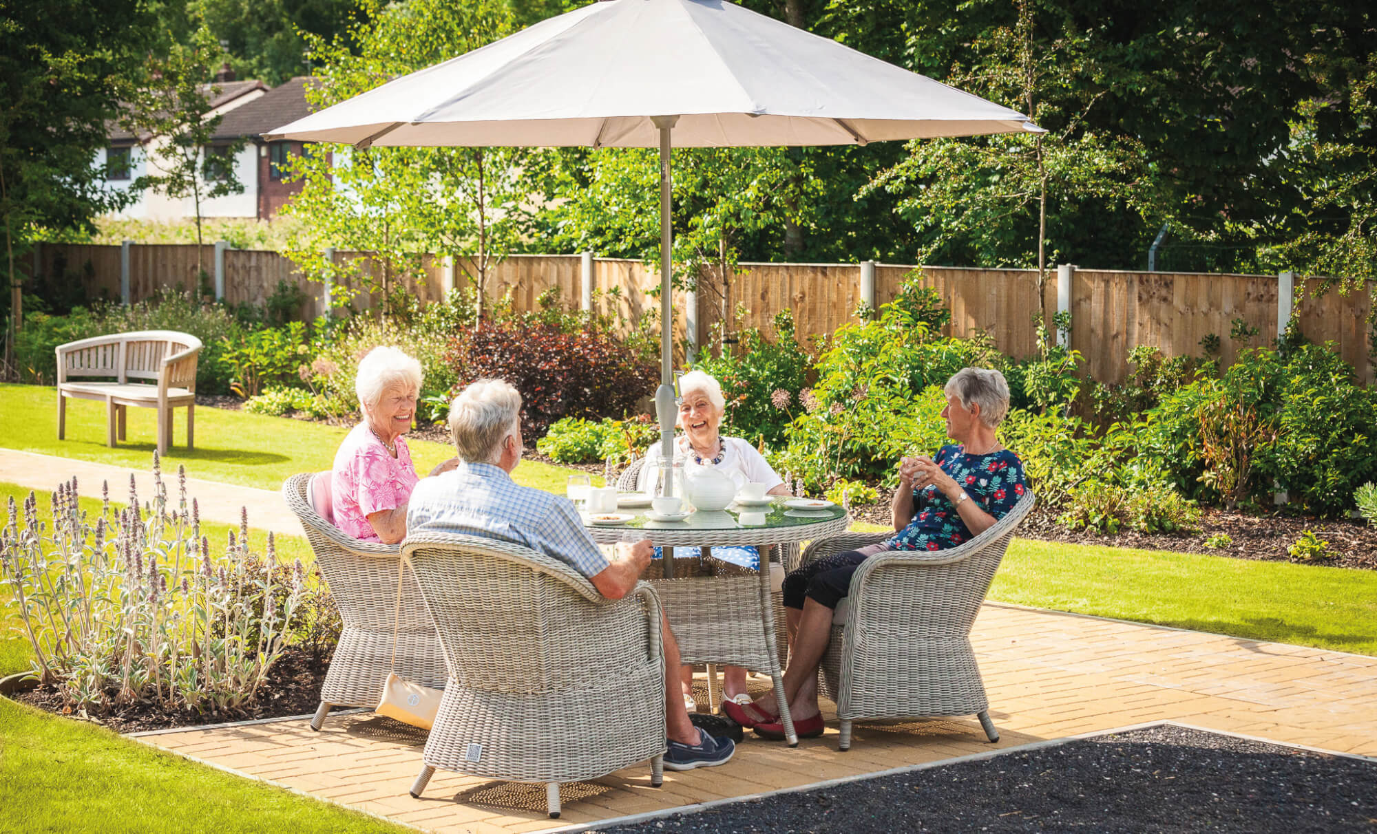 Adlington Retirement Living homeowners relaxing in the maintained gardens
