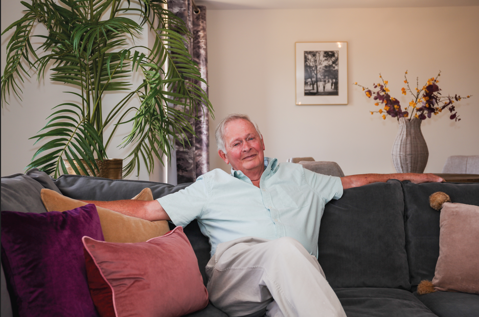Homeowner Tony sat in his Adlington Retirment Living apartment